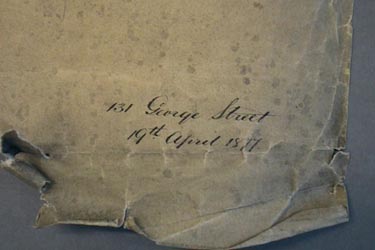 Corner of plan before repair of tears and creases.